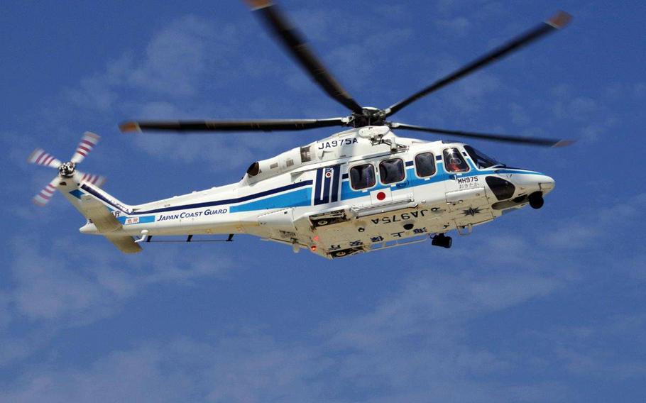 A Japan Coast Guard helicopter, similar to the one in this undated photo, rescued three U.S. Marines swept out to sea while snorkeling off Okinawa on Saturday, Oct. 30, 2021. 