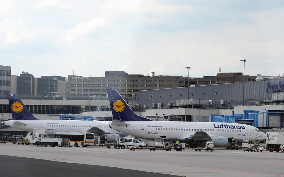 Lufthansa planes wait at a Frankfurt International Airport terminal in 2019. 