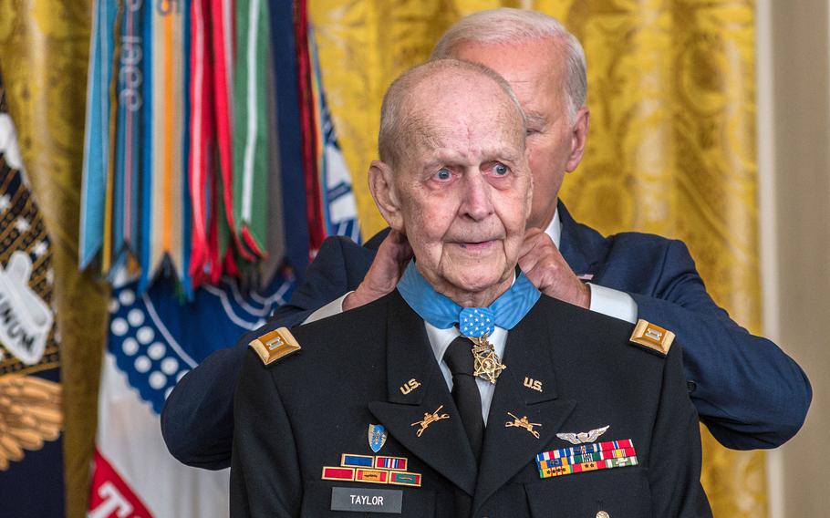 Vietnam veteran Larry Taylor tries to hold back tears as President Joe Biden places the Medal of Honor around his neck during a ceremony at the White House on Tuesday, Sept. 5, 2023.