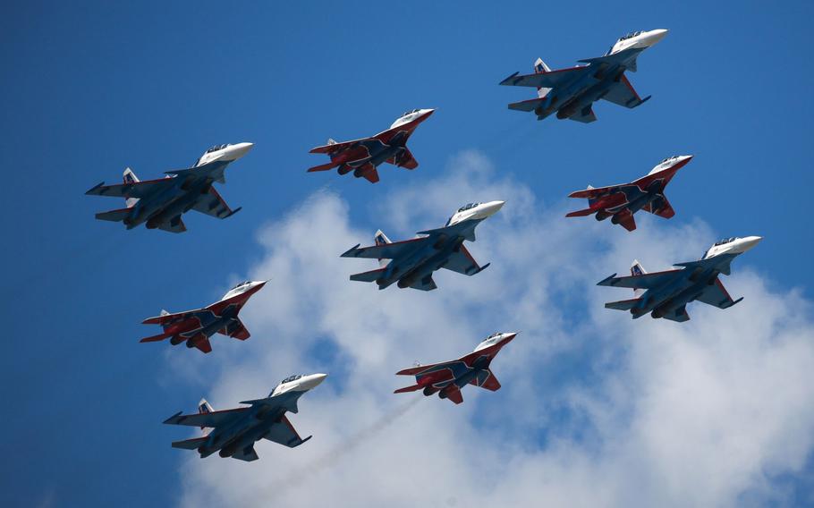 The Russian Knights and Strizhi aerobatic units fly Sukhoi Su-30SM and Mikoyan MiG-29 fighter jets during the victory day parade in Moscow on June 24, 2020. 