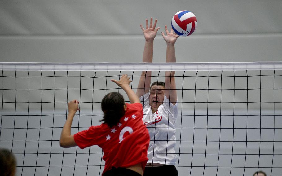 White Team's Kennedy Lange of Ansbach tries to block a spike by Red Team's A'Lydia McNeal of Lakenheath during a DODEA-Europe all-star volleyball match on Nov. 4, 2023, at Ramstein High School on Ramstein Air Base, Germany.