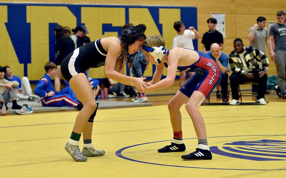 Rota's Quen Kirkconnell and Ramstein's Jonah Hancock hand-fight during the 106-pound third-place match at the Warrior Wraggle on Jan. 13, 2024, at Wiesbaden High School in Wiesbaden, Germany.