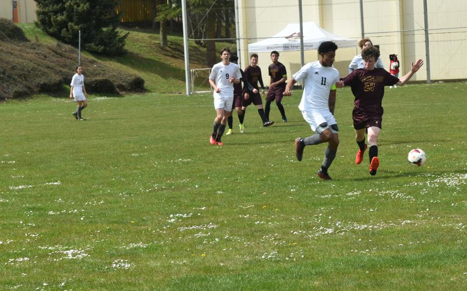 Ansbach’s Shane Nesbitt attempts to pass the ball while Baumholder’s Antonio Robles defends on Saturday, April 23, 2022 during a soccer match in Baumholder, Germany.