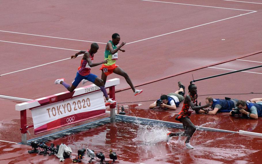 Army Spc. Benard Keter, left, ran a personal best 8:17.31 to reach the Olympics steeplechase final at new National Stadium in Tokyo, July 30, 2021. 