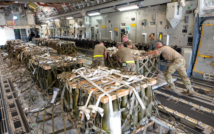 Team Dover Airmen load pallets of ammunition onto a C-17 Globemaster III bound for Ukraine during a security assistance mission at Dover Air Force Base, Del., Aug. 9, 2022. 