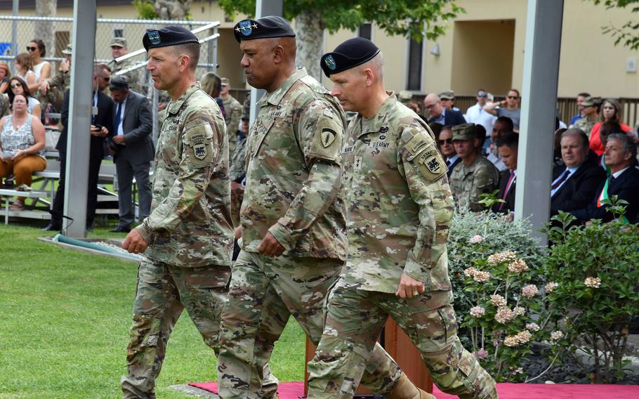 Maj. Gen. Andrew M. Rohling, U.S. Army Southern European Task Force, Africa outgoing commander; Gen. Darryl Williams, commander of U.S. Army Europe and Africa; and Maj. Gen. Todd Wasmund, the incoming SETAF-AF commander, proceed during the change of command ceremony at Caserma Ederle in Vicenza, Italy, July 14, 2022. 