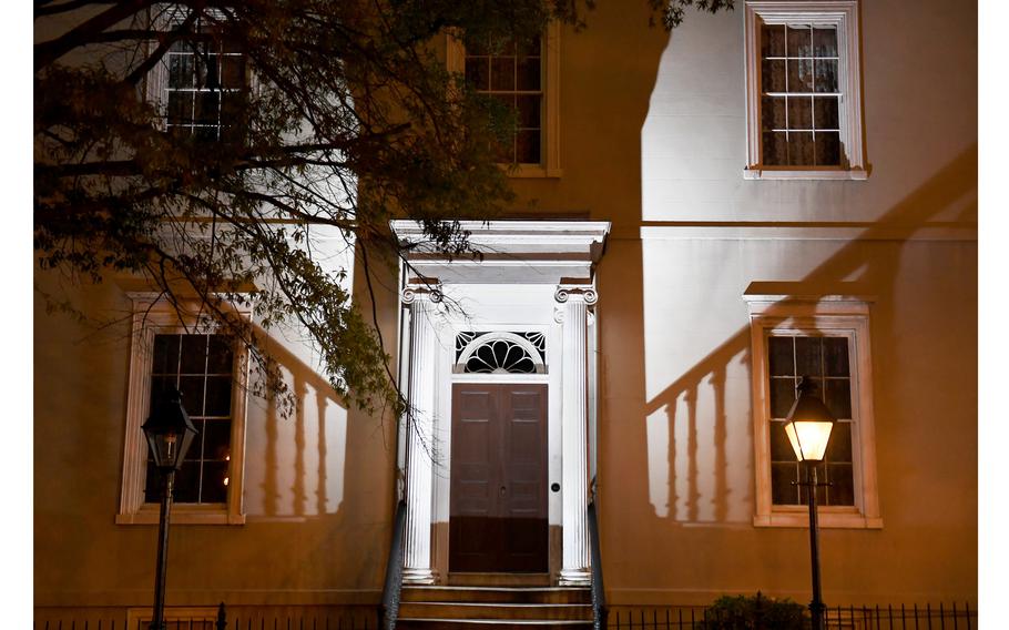 A flash illuminates the outside of the White House of the Confederacy in Richmond, Va., where Jim Limber lived during the final year of the Civil War.