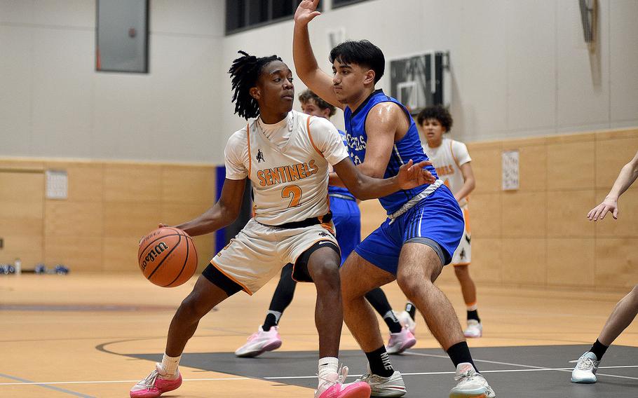 Spagdahlem's Makario Drummond backs down Hohenfels' Jayden Ruelas in the low block during a basketball game on Jan. 26, 2024, at Spangdahlem High School in Spangdahlem, Germany.