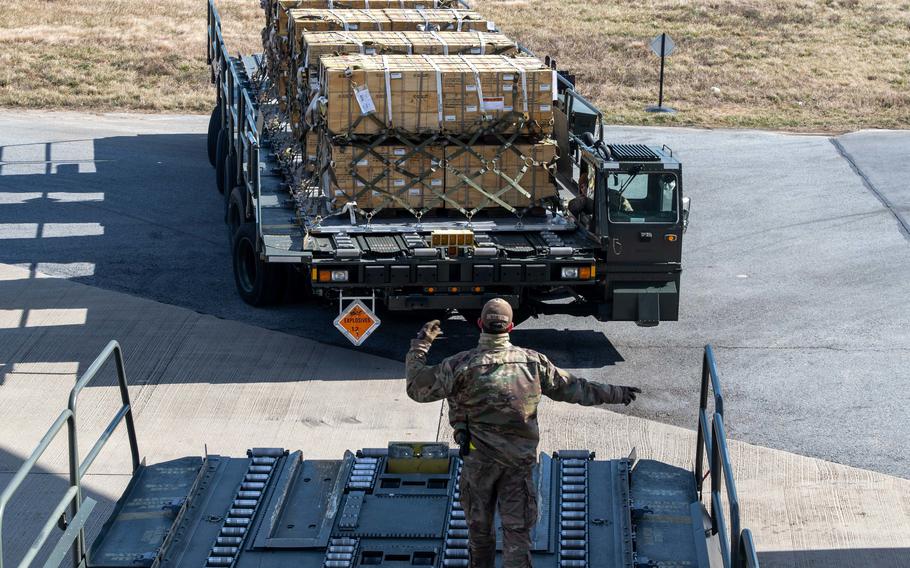 Senior Airman Cameron Manson, a 436th Aerial Port Squadron ramp operation specialist, helps load cargo on Feb. 3, 2023, during a security assistance mission at Dover Air Force Base, Del. 