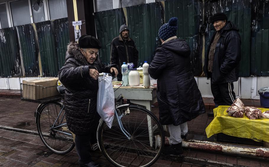 Vendors sell meat and vegetables in Lyman.