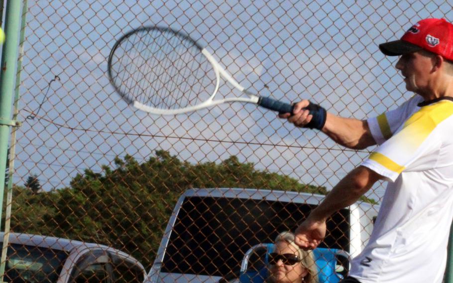 Kadena's Micah Berry hits a forehand against Kubasak's Jacy Fisk during Thursday's Okinawa tennis matches. Berry won 9-8 (11-9) in a tiebreak.