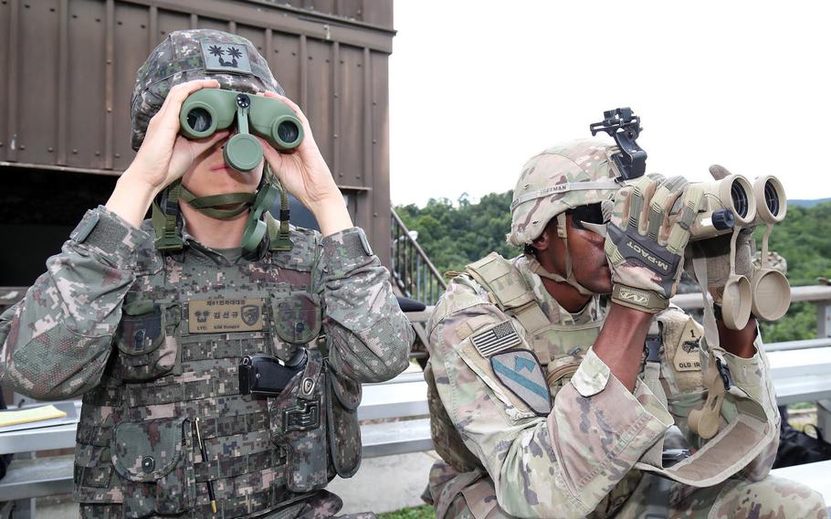 U.S. and South Korean soldiers watch as a multiple launch rocket system fires in Gangwon Province, South Korea, Aug. 31, 2022.