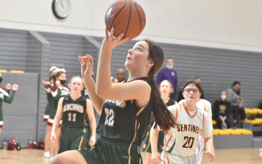 AFNORTH's Paula Bohlen drives to the basket for points Thursday, Feb. 24, 2022, at the DODEA-Europe Division III basketball championships.