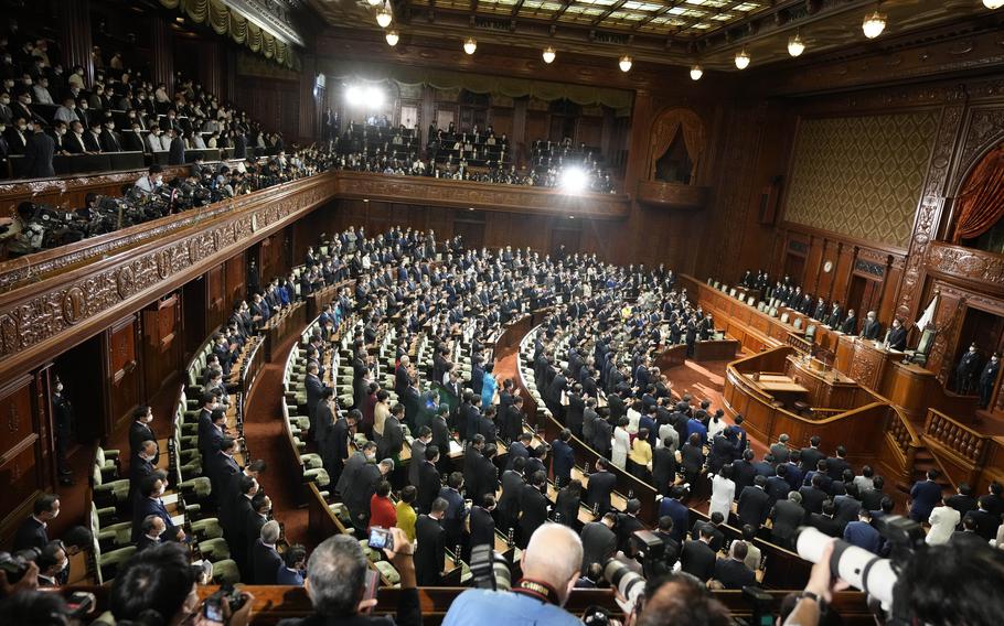 Lawmakers listen to the announcement of the dissolution of the lower house Thursday, Oct. 14, 2021, in Tokyo. Japan’s new Prime Minister Fumio Kishida dissolved the lower house of parliament Thursday, paving the way for Oct. 31 national elections.
