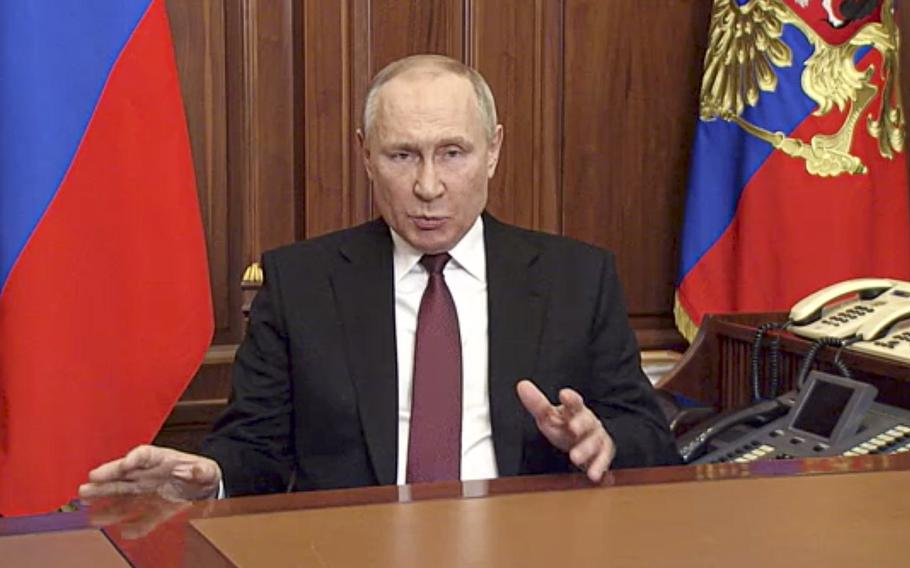 In this image made from video released by the Russian Presidential Press Service, Russian President Vladimir Putin addressees the nation in Moscow, Russia, Thursday, Feb. 24, 2022. Russian troops launched their anticipated attack on Ukraine on Thursday, as Putin cast aside international condemnation and sanctions and warned other countries that any attempt to interfere would lead to “consequences you have never seen.”  