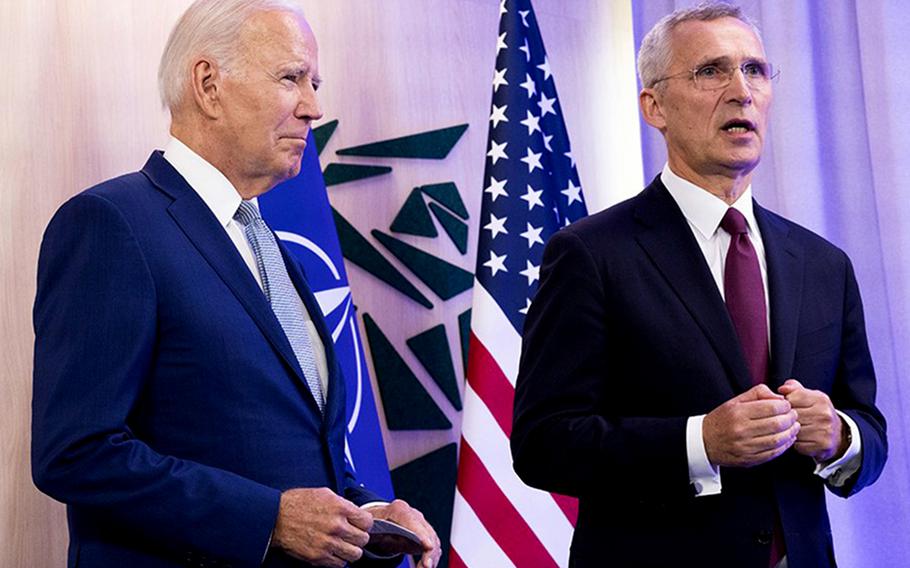 U.S. President Joe Biden, left, listens to remarks by NATO Secretary-General Jens Stoltenberg on July 11, 2023, before the start of the alliance's summit in Vilnius, Lithuania.