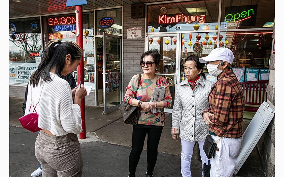 Jamie-Claire Chau, one of the organizers of Viet Place Collective at Eden Center, in Falls Church, Va., speaks March 29, 2023, with members of the local Vietnamese community. 