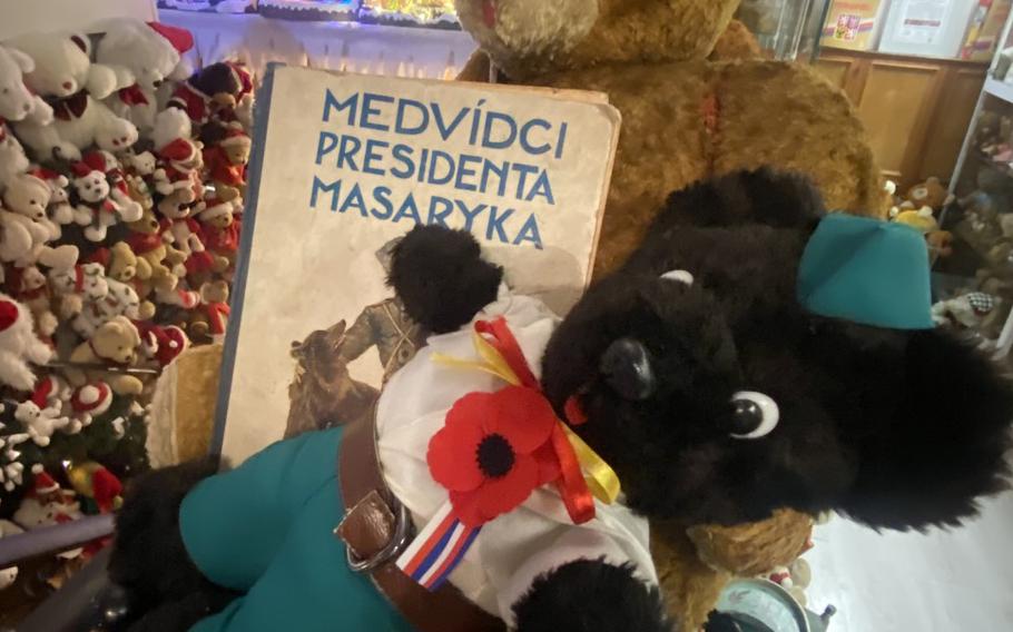 Stuffed toy bears are posed with an old-time children's book titled "President Masaryk's Teddy Bears" at the Christmas House in Karlovy Vary, Czech Republic. The building also houses a museum with a collection of over 12,000 teddy bears.