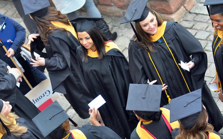 Graduates at the University of Maryland University Global Campus commencement ceremony in Kaiserslautern, Germany, in 2016. The Defense Department awarded a five-year contract to the university to continue teaching U.S. troops overseas, according to a statement released June 7, 2023.