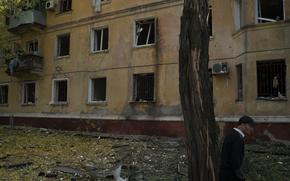 A man walks past a damaged building after a Russian attack in Kramatorsk, Ukraine, Thursday, Sept. 29, 2022. 