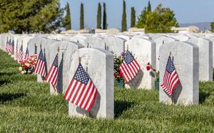 Flags respectfully placed for Memorial Day for Veterans of Foreign Wars at rest at Sacramento Valley National Cemetery located in Dixon, California.