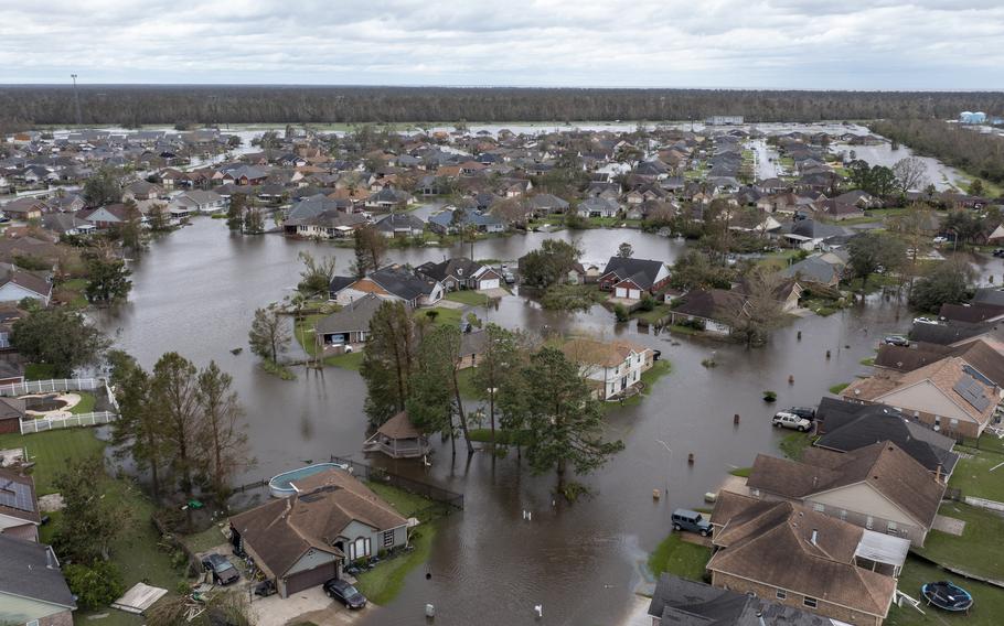 Flooded streets and homes are shown in the Spring Meadow subdivision in LaPlace, La., after Hurricane Ida moved through Monday, Aug. 30, 2021. Hard-hit LaPlace is squeezed between the Mississippi River and Lake Pontchartrain. 