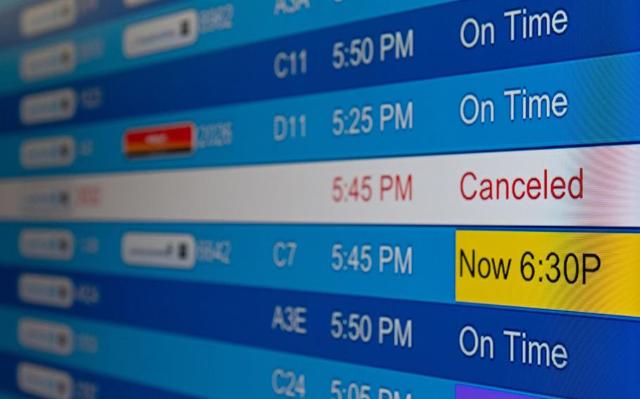 Canceled flights are seen on an electronic board at Washington Dulles International Airport in Dulles, Va., on Dec. 24, 2021. 