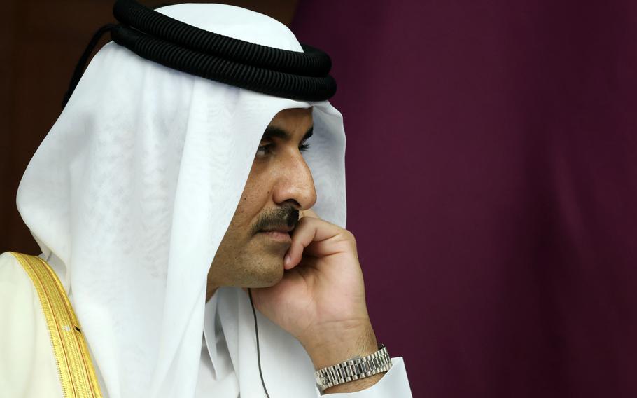 The Emir of Qatar, Sheikh Tamim bin Hamad Al Thani reacts during a meeting, in Astana, Kazakhstan, Thursday, Oct. 13, 2022.