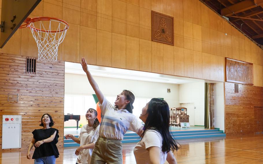 Glampers play basketball in the former school’s gym. 