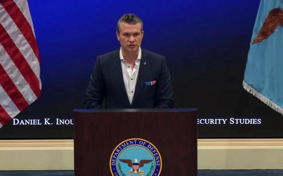 Defense Secretary Pete Hegseth speaks during a gathering.