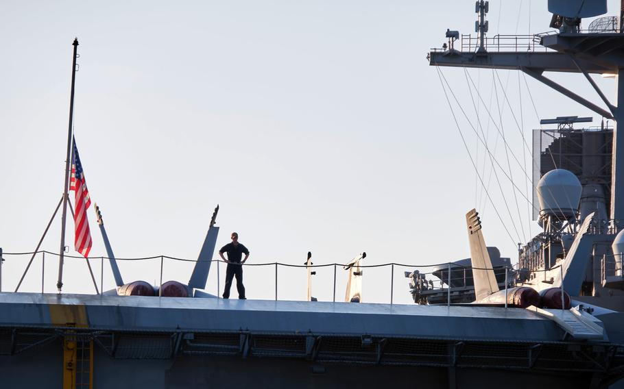 The USS Carl Vinson aircraft carrier arrives for a port call at Yokosuka Naval Base, Japan, Saturday, Aug. 28, 2021.