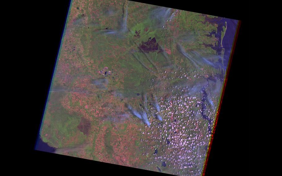 A satellite false-color composite image using infrared, near-infrared, and green wavelengths shows an overhead view of the Okefenokee National Wildlife Refuge in southern Georgia on May 15, 2002. A titanium mine planned on the doorstep of the refuge was dealt a major blow Friday, June 3, 2002, when the U.S. Army Corps of Engineers moved to restore federal oversight of the project.