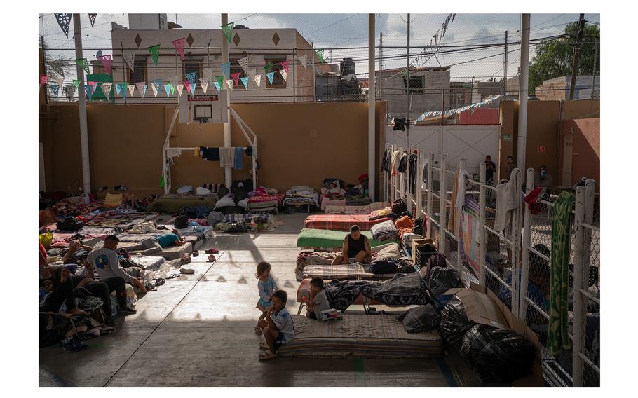 Migrants sleep on a basketball court at the over-capacity Charity House Migrant Shelter in San Luis Potosí, Mexico. 