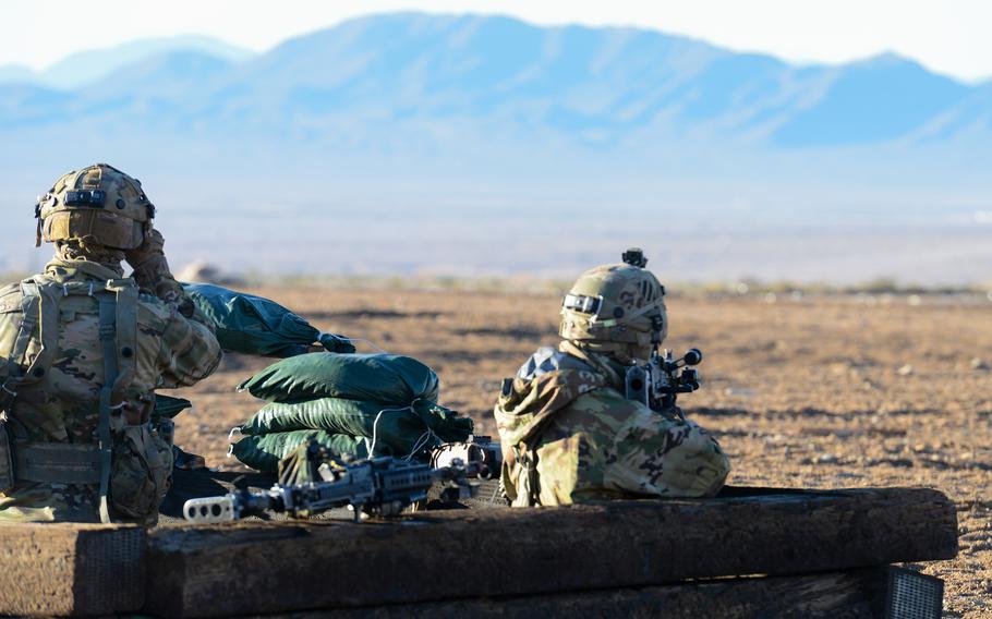 3rd Infantry Division soldiers man fighting positions inside a trench during a force-on-force battle at the Army’s National Training Center at Fort Irwin in California’s Mojave Desert on Feb. 27, 2023.