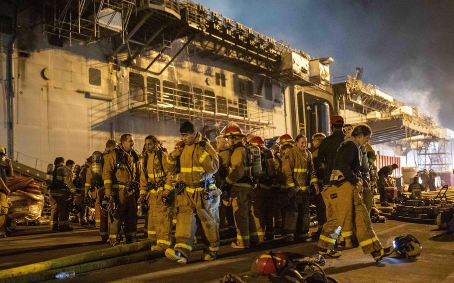Sailors combat a fire aboard the amphibious assault ship USS Bonhomme Richard (LHD 6). On the morning of July 12, 2020, a fire was called away aboard the ship while it was moored pierside at Naval Base San Diego. Base and shipboard firefighters responded to the fire.