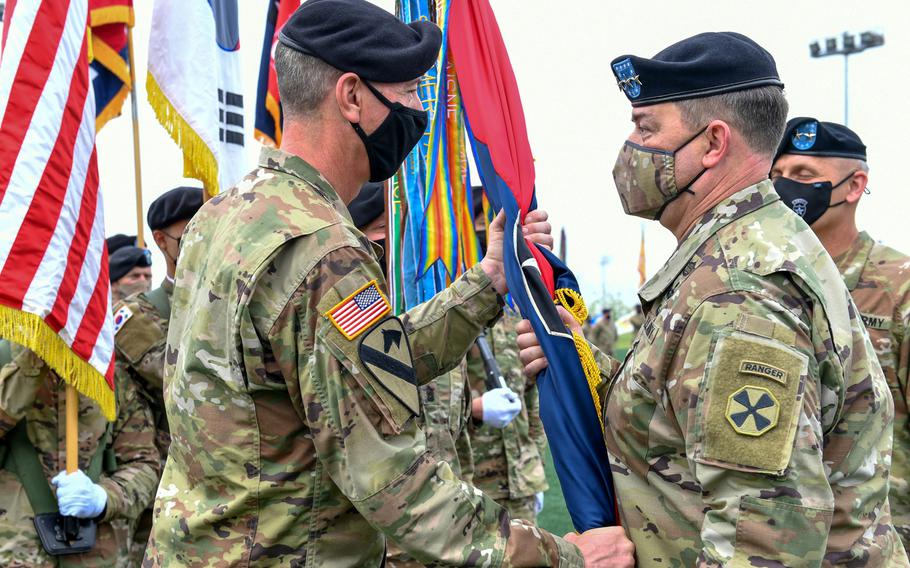 Maj. Gen. David Lesperance accepts the 2nd Infantry Division colors from Eighth Army's commander, Lt. Gen. Willard Burleson, at Camp Humphreys, South Korea, Tuesday, May 18, 2021. 