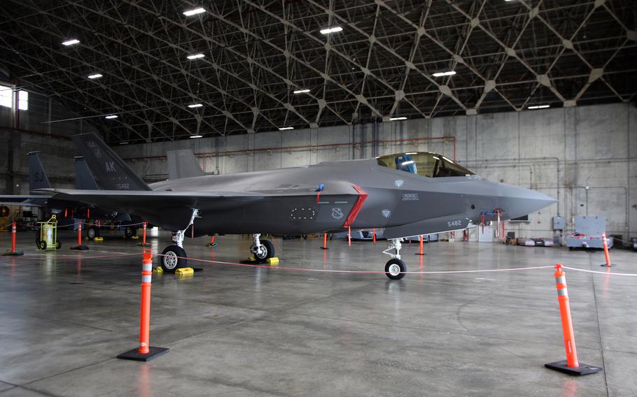 An F-35A Lightning II stealth fighter, temporarily deployed from the 355th Fighter Squadron at Eielson Air Force Base, Alaska, sits in a hangar at Kadena Air Base, Okinawa, Friday, June 16, 2023.
