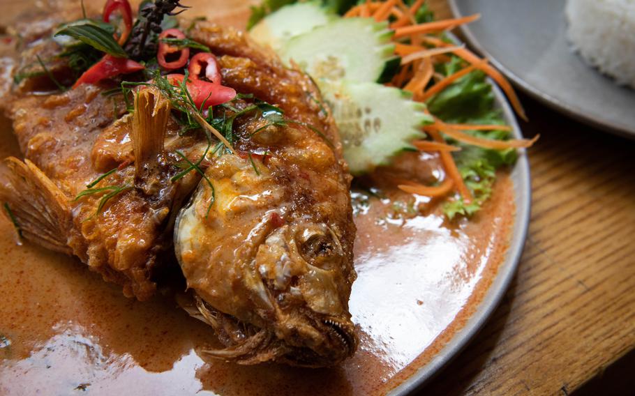 The susi pla at Tida Thai Restaurant is a whole tilapia fish served with a red curry sauce, chili and kaffir leaves. 