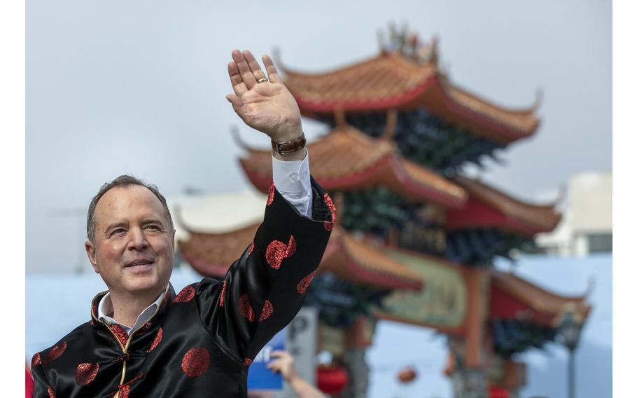 Congressman Adam Schiff, California Senate candidate, waves to the crowd while riding along Broadway in downtown Los Angeles during the Los Angeles Lunar New Year Parade on Feb. 17, 2024.