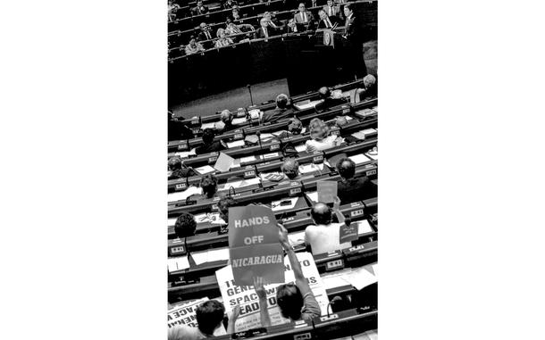 Red Grandy ©Stars and Stripes
Strasbourg, France, May, 1985: As President Ronald Reagan (top right) speaks to the European Parliament, members of the group hold up signs protesting nuclear weapons and U.S. policy in Central America.