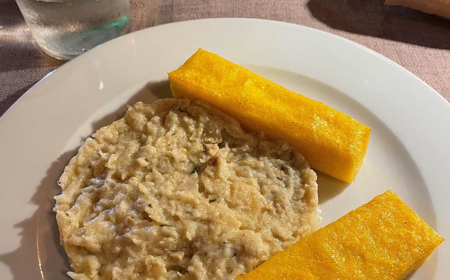 Osteria Monelli in downtown Vicenza offers a tasty menu of local specialties, like this cod dish served with a side of fried polenta. 