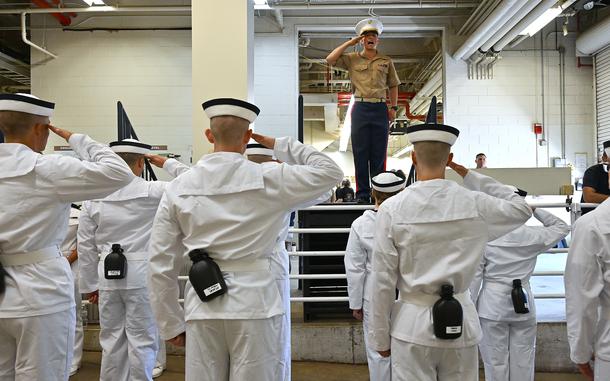 Marine 2nd Lieutenant Colin DuPont instructs incoming plebes on how to salute. The U.S. Naval Academy welcomed approximately 1,200 plebes, or freshman, members into the Class of 2029 when they reported for Induction Day on Thursday. (Paul W. Gillespie/Staff)