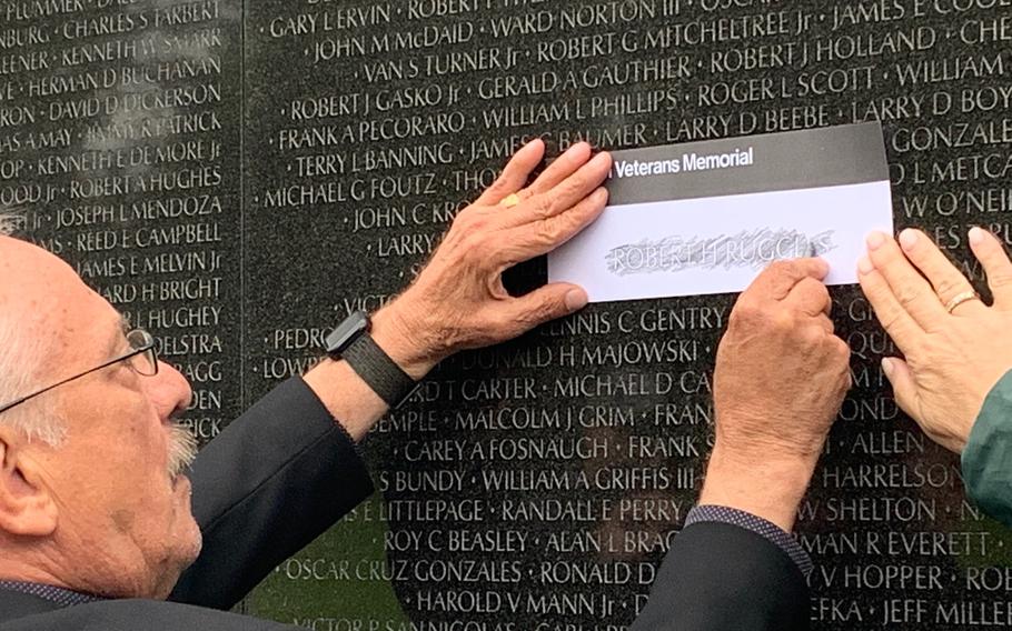 Jan Scruggs, founder of the Vietnam Veterans Memorial Fund, makes a rubbing of a name on the memorial’s wall. The Wall of Faces, a project to find a photo for each of the more than 58,000 service members listed on the wall who were killed or missing in action in Vietnam, was completed in August 2022, just in time for the memorial’s 40th anniversary.