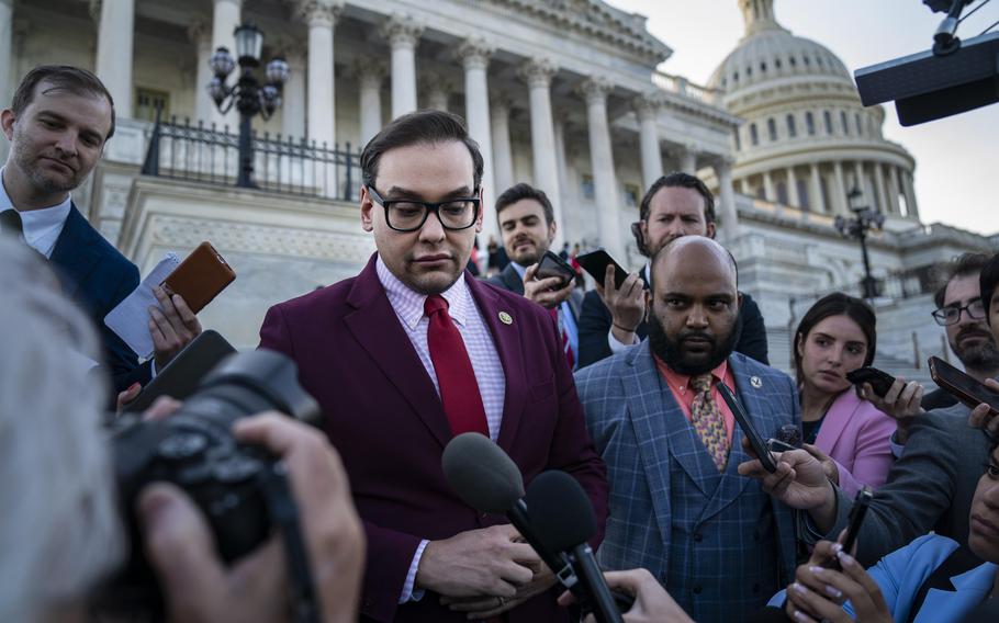 Rep. George Santos (R-N.Y.) speaks to reporters after a vote to send a resolution to the Ethics panel in an attempt to expel him from the House on Wednesday.