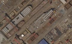 This satellite image from Planet Labs PBC shows construction of China's Type 003 aircraft carrier at the Jiangnan Shipyard northeast of Shanghai, China, May 8, 2022.  