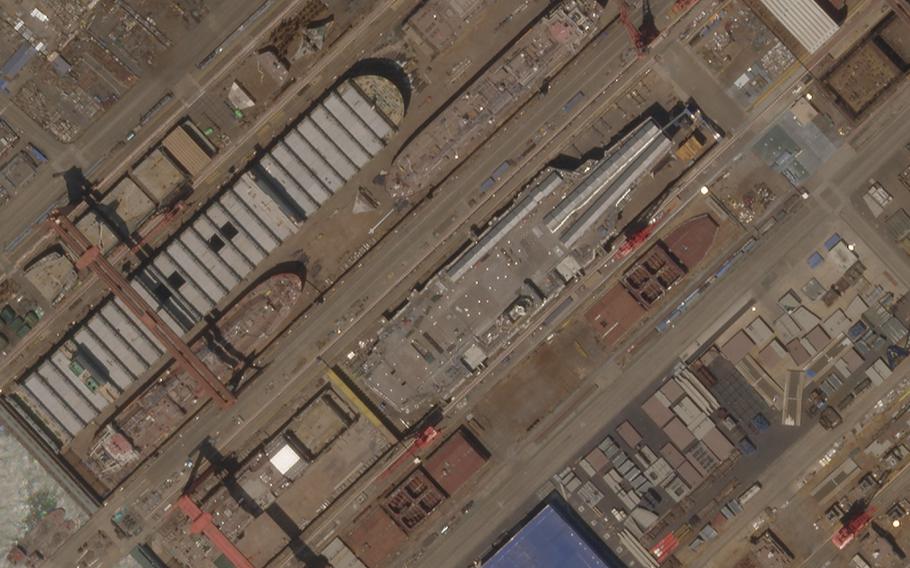 This satellite image from Planet Labs PBC shows construction of China’s Type 003 aircraft carrier at the Jiangnan Shipyard northeast of Shanghai, China, May 8, 2022.  