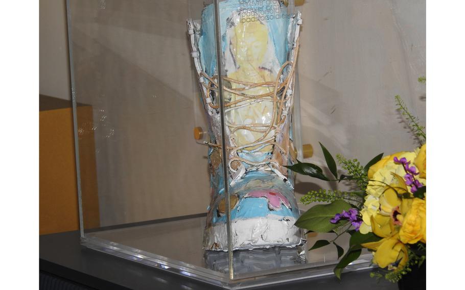 One of the boots that part of the Footsteps of Freedom art installation, which opened Monday, April 1, 2024, at Walter Reed.