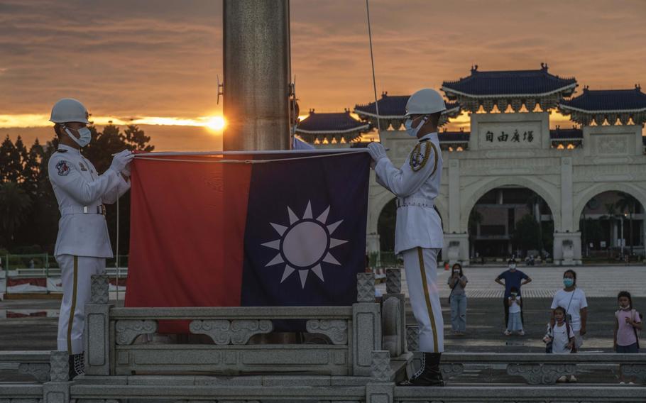 Soldiers lower the Taiwanese flag during a ceremony at the Chiang Kai-shek Memorial Hall in Taipei, Taiwan. on Aug. 4, 2022.