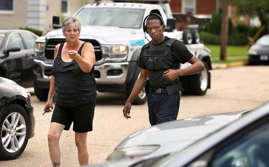 Sherry Okamoto and repo agent Nio Hollie look for a stolen car in Norfolk on Friday, August 5, 2022. Okamoto came to Hampton Roads from CA a couple of weeks ago to help her son find his stolen car. She eventually tracked it down, but before returning home she made it her mission to look for other people's stolen vehicles.