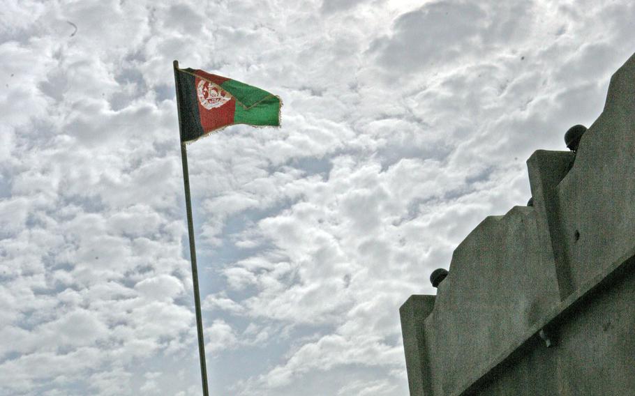 An Afghanistan flag is raised over Helmand province in 2010. 